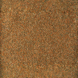 Textured background of finely crushed natural materials in warm earthy tones.
