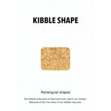 Rectangular-shaped kibble for Ultra Dog Superwoof dog food, highlighting natural ingredients and variations in color.