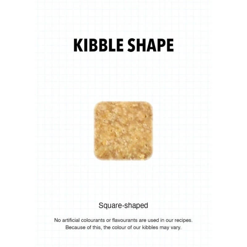Square-shaped kibble piece for Ultra Dog Superwoof dog food, highlighting natural ingredients and no artificial additives.