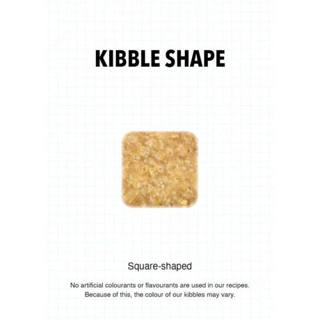 Square-shaped kibble piece for Ultra Dog Superwoof dog food, highlighting natural ingredients and no artificial additives.