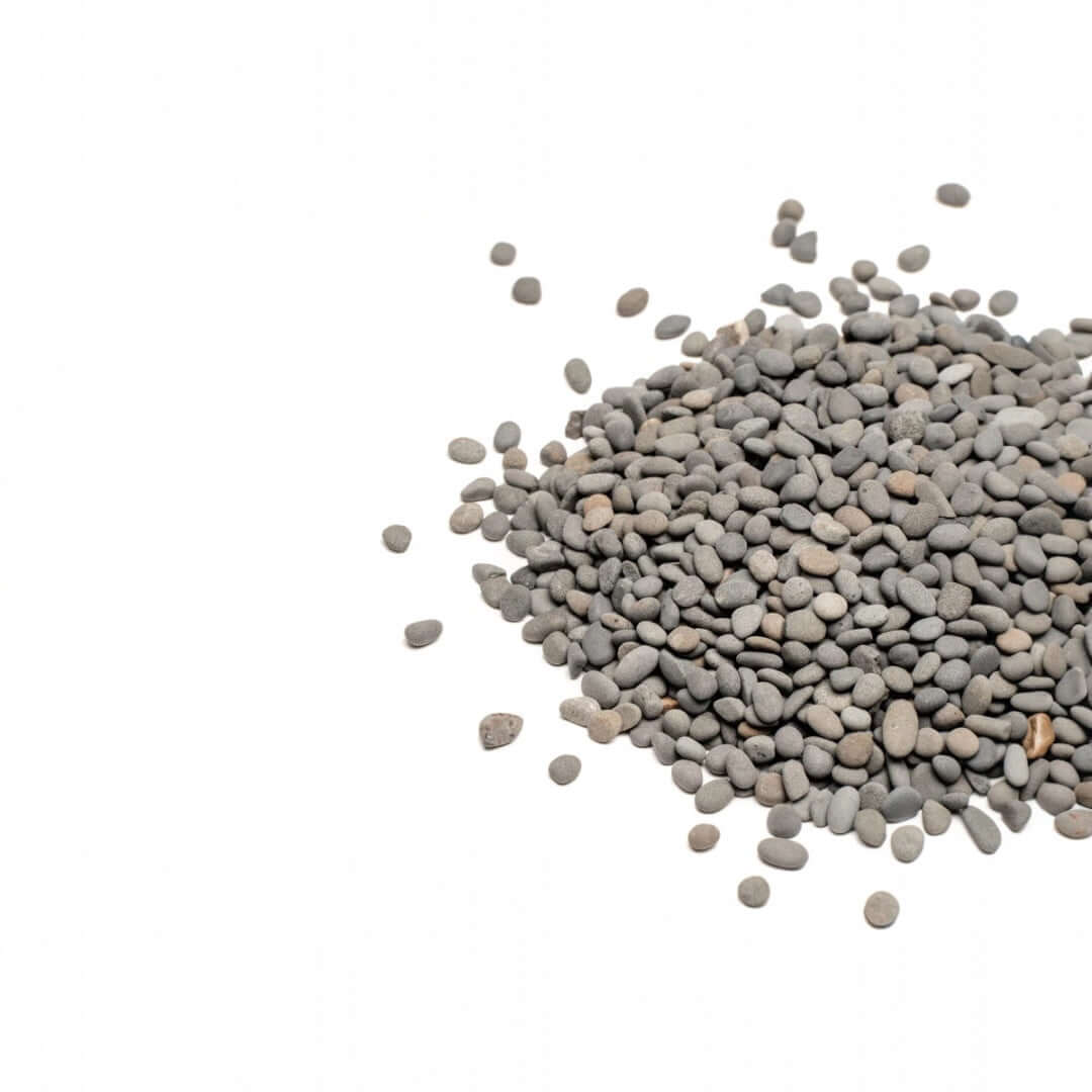 Natural grey granules of UNS Controsand Kona substrate for aquariums and terrariums.