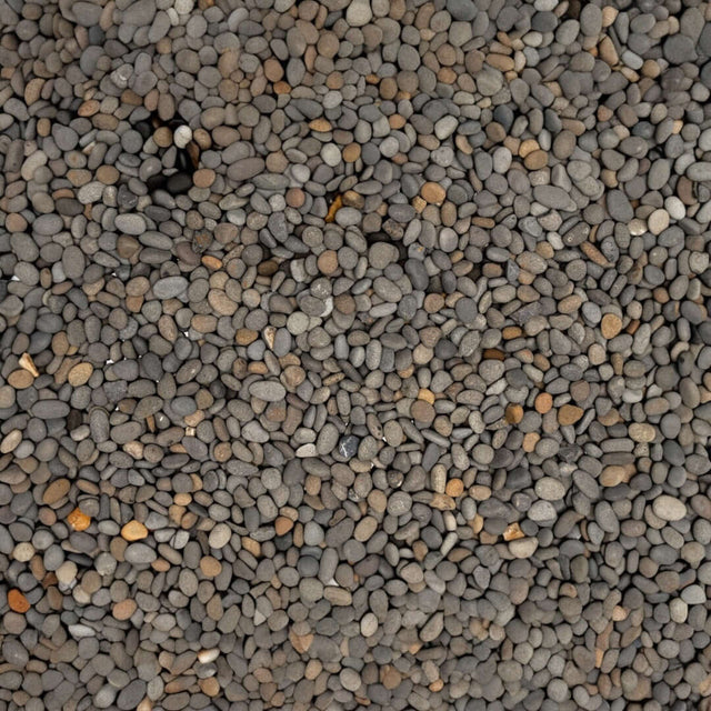 Natural UNS Controsand Kona substrate for aquariums, featuring a blend of smooth gray and brown granules.