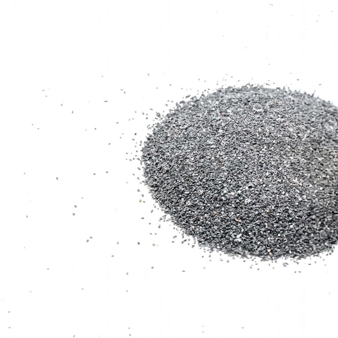 Gray granules of UNS Controsand Maui substrate for freshwater aquariums and terrariums.