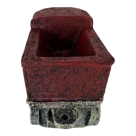 Vintage red train truck aquarium ornament with textured surface, resembling a classic freight car.