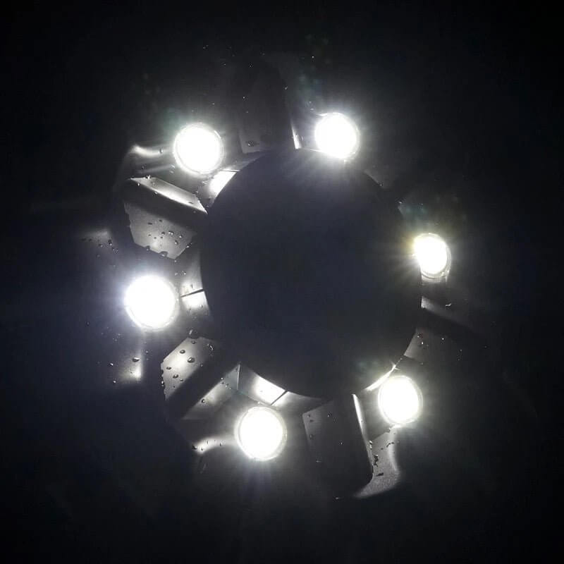 Boyu Floating Fountain Air Pump LED lights illuminating water feature in dark setting. Elegant design and efficient aeration.