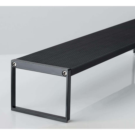 Close-up of the sleek, black Chihiros WRGB II Slim Series LED light fixture showcasing its modern design and ribbed surface.