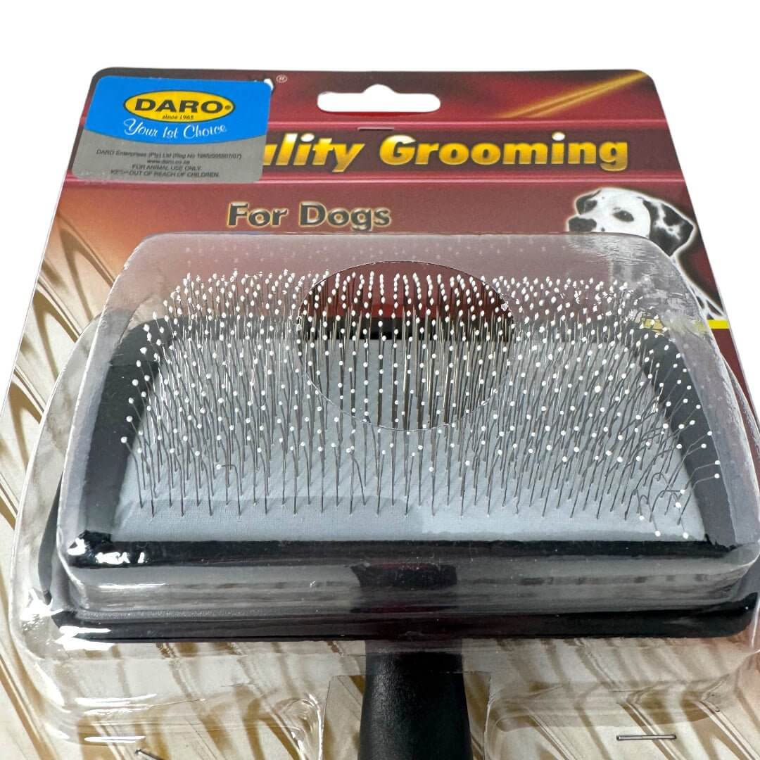 Dog curved slicker brush in packaging for gentle grooming and untangling dog coats. Ideal for quality pet care.