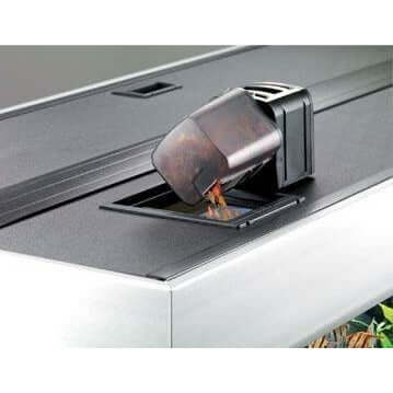 EHEIM Automatic Fish Feeder dispensing food into aquarium, ideal for effortless fish feeding during busy times.