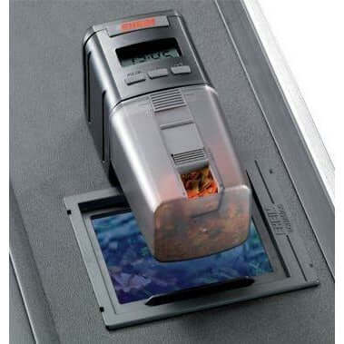 EHEIM Automatic Fish Feeder displaying digital settings and food compartment for hassle-free fish feeding.