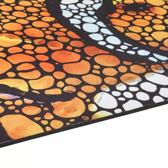 Close-up view of Flipper Clownfish Anti-Fatigue Floor Mat featuring vibrant orange and black bubble design, showcasing its waterproof edge.