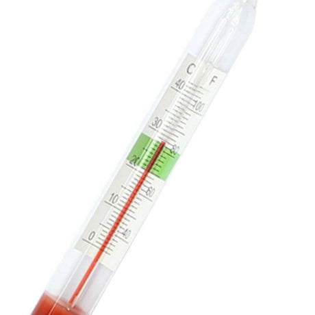 Floating aquarium glass hydrometer with built-in thermometer displaying temperature measurements in Celsius and Fahrenheit.