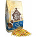 Tiny Friends Gerty Guinea Pig Tasty Mix food bag and colorful mix on the ground for healthy pet nutrition.