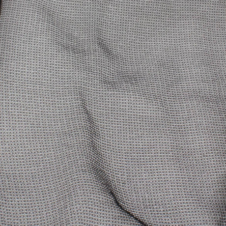 close-up of textured gray fabric with a woven pattern, showcasing its durable and versatile design.