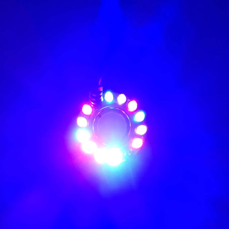 Colorful LED lights arranged in a circle emitting vibrant blue, red, and green hues, creating a mystical ambiance.