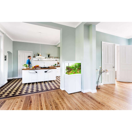 Modern living space featuring Juwel Lido Aquarium in stylish cabinet beside elegant kitchen decor.
