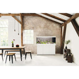 Juwel Rio Aquarium and Cabinet in a stylish interior with wooden beams and a modern dining table.