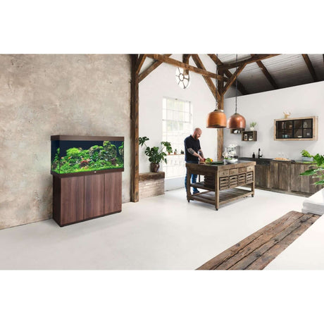 Modern interior featuring Juwel Rio Aquarium and Cabinet with vibrant aquatic life in a stylish kitchen setting.