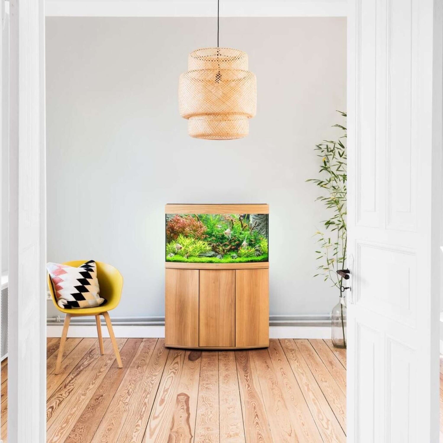 Juwel Vision Aquarium and Cabinet in a stylish living room with plants and modern decor.