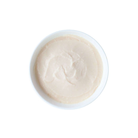 Smooth cat treat puree in a white bowl, ideal for joint care with chicken and glucosamine.