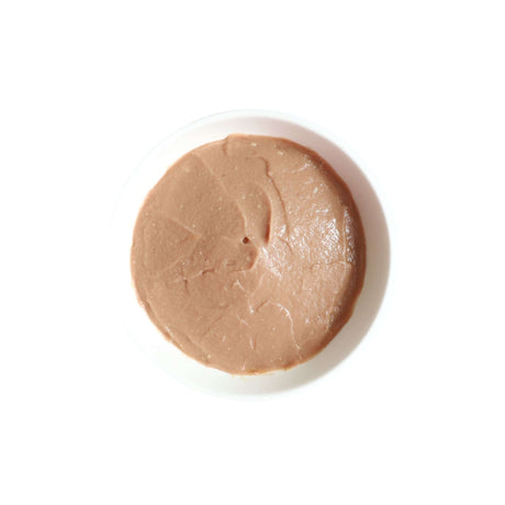 Smooth tuna puree for cats, featuring natural ingredients and no added colors or preservatives.