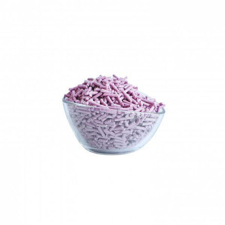 Bowl of Kit Cat Soya Clumping Cat Litter displaying eco-friendly purple pellets.