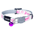 Adjustable Rogz Glow Cat Collar with pink floral design and purple bell, featuring a breakaway safety buckle.