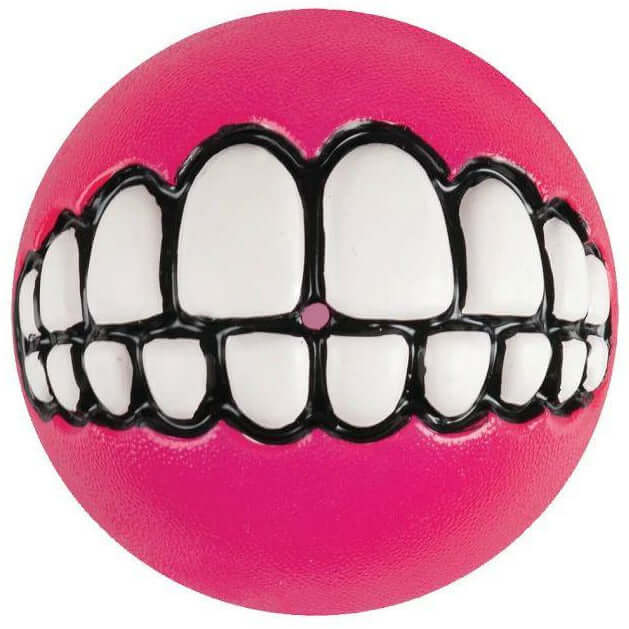 Rogz Grinz Dog Toy in pink with a cartoonish white teeth design, perfect for playful fetch sessions with dogs.