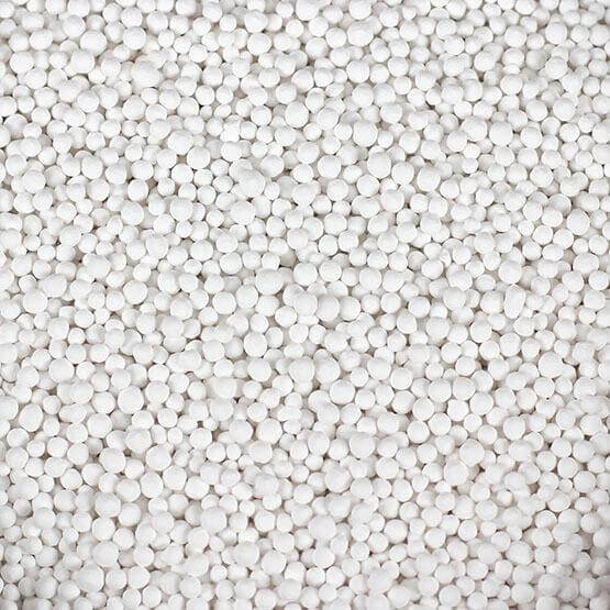 White spherical beads of Seachem PhosGuard for removing phosphate and silicate in aquaria.