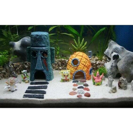 SpongeBob SquarePants aquarium ornament set featuring pineapple house, Squidward's house, and characters in a sandy environment.