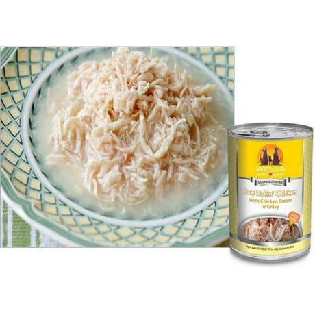 Shredded chicken in gravy served in a bowl next to a can of Weruva Paw Lickin Chicken Wet Dog Food.