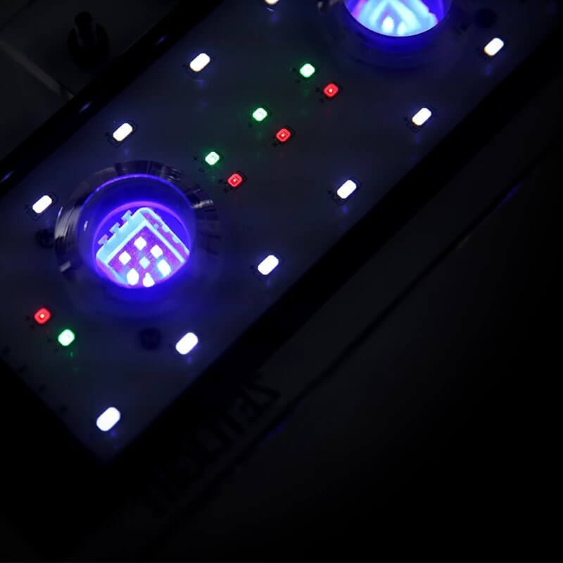 Zetlight Aqua ZA1201-Ai WiFi Marine LED control panel with blue and green lights, showcasing app-controlled features.